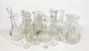 An assortment of Victorian and vintage etched glassware, including various decanters, jugs and