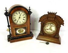 Two Continental mantel clocks, late 19th century, including an arched topped example with ebonized