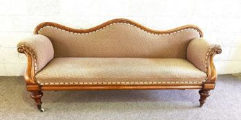 A Victorian double ended walnut day bed or settee, circa 1860, with a serpentine moulded back,