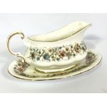 A large assortment of bone china, including a part dinner service, decorated with bands of