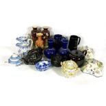 An assortment of ceramics and related, including assorted blue and white transfer printed jugs,