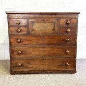 An early Scottish Victorian chest of drawers, circa 1840, with a central large hat drawer, flanked