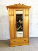 An Edwardian satin birch bedroom suite, including a dressing table, with hinged mirrored back over