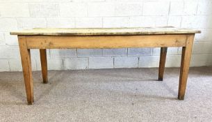 A vintage stripped pine kitchen refectory table, with planked top and tapered legs, 78cm high, 180cm