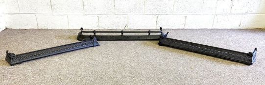 Three cast iron decorative fire curbs, another curb and a spark guard (5)
