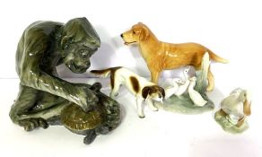 A group of ceramic animal figures, including a large monkey catching a terrapin; a retriever; duck