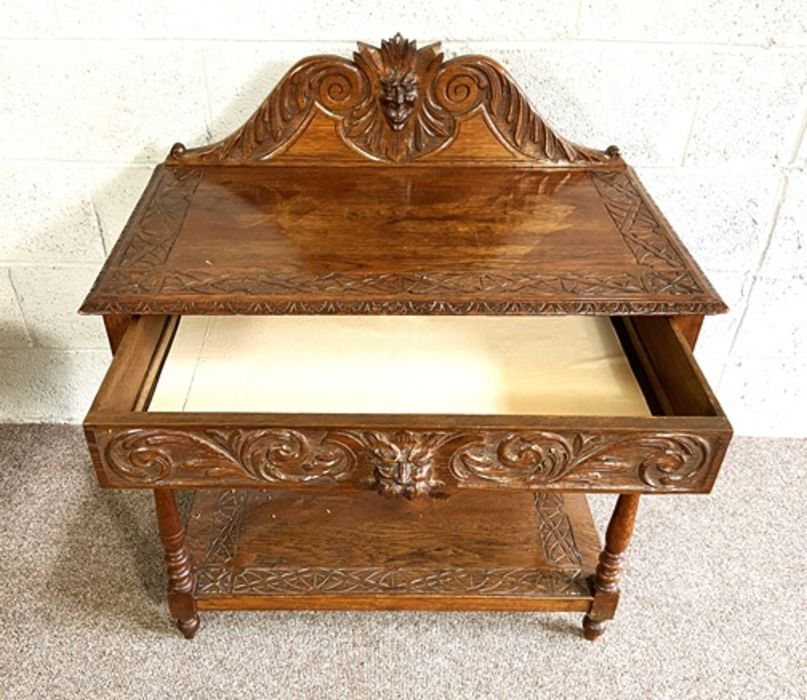 A late Victorian Jacobean style oak hall table, with gallery back and single drawer, carved with - Image 3 of 6