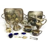 A selection of silver plate, including a claret jug, two graduated tea trays, muffin dish, hot water