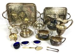 A selection of silver plate, including a claret jug, two graduated tea trays, muffin dish, hot water