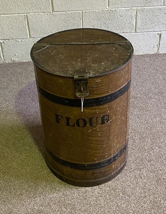 A vintage painted tin flour bin, in the style of a barrel, with hinged lid