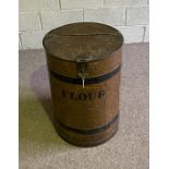 A vintage painted tin flour bin, in the style of a barrel, with hinged lid