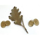 A 9 carat gold patinated oak leaf brooch, naturalistically modelled with hallmark to pin, 8.5g;