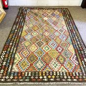 An Afghan style geometric decorated rug and another similar smaller, modern 294cm x 200cm (