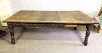 A good and large Jacobean style oak extending dining table, early 20th century, with a moulded