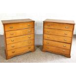 A pair of modern ash veneered chests of drawers, each with five graduated drawers (2)