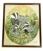 A large assortment of cross stitch and embroidered pictures, including otter, fox, badger and others