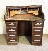 A late Victorian oak tambour front desk, with fitted interior