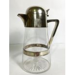 A vintage silver plated and conical glass claret jug, with hinged and domed lid, side handle and