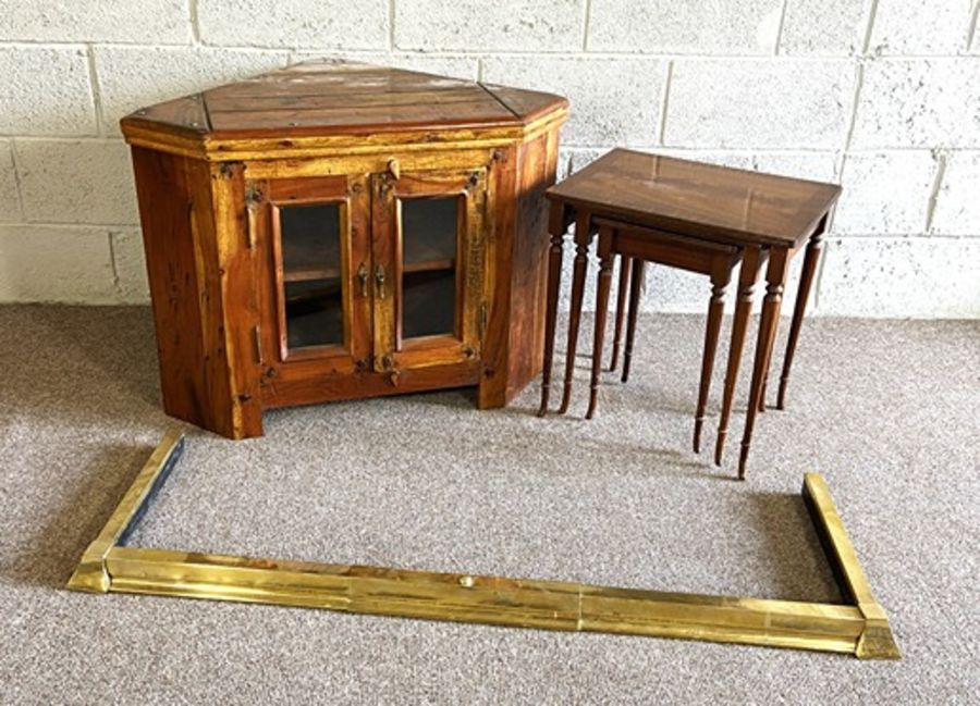 A corner display unit or tv stand; together with a fire curb, and nest of three tables (3)