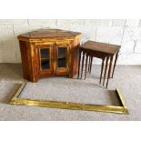 A corner display unit or tv stand; together with a fire curb, and nest of three tables (3)