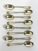A set of eight silver tea spoons, Sheffield 1909, with fluted finials, 137g