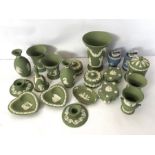 A selection of Wedgwood green jasperware, 20th century, with various vases, pin trays and Campana