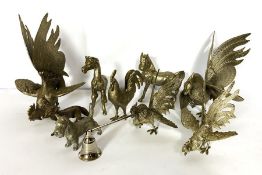 A group of silver plated table decorations, including a pair of cockerell's, another smaller pair, a