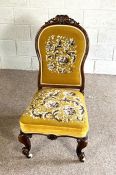 A pretty Victorian walnut framed nursing chair, circa 1870, with later floral tapestry back and