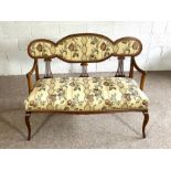 An Edwardian mahogany framed settee, circa 1900, with padded chair back, overstuffed seat and