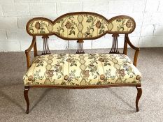 An Edwardian mahogany framed settee, circa 1900, with padded chair back, overstuffed seat and
