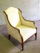 A late Victorian mahogany framed wing armchair, currently upholstered in cream