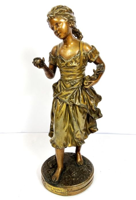 A French patinated spelter figure of a young girl, "Fruit Défendu", after Rancoulet, late 19th