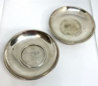 A pair of silver bowls, each inset with a 1780 Maria Theresa silver thaler coin, 8.5cm diameter,