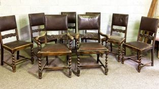 A set of eight Jacobean style oak dining chairs, early 20th century, with padded and scroll carved