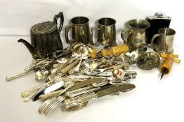 A large assortment of silver plated flatware and related items, including four tankards, a hip