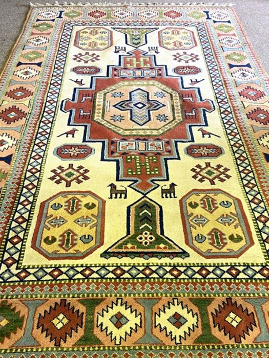 A modern Kazak style decorative rug, decorated with a central medallion on a cream field, 317cm x - Image 2 of 4