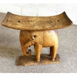 Two carved tribal stools, including one with an elephant support, 20th century (2)