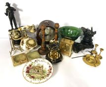 An assortment including three mantel clocks, a vintage style telephone, spelter figures, brassware