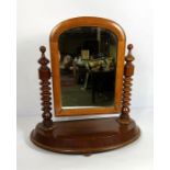 A Victorian walnut dressing swing mirror, late 19th century, with turned supports; also a small nest