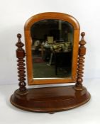 A Victorian walnut dressing swing mirror, late 19th century, with turned supports; also a small nest