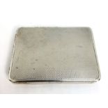 A silver card calling card case, hallmarked Birmingham, 1926, engine turned and gilt lined, 8cm