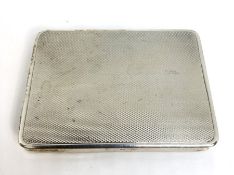 A silver card calling card case, hallmarked Birmingham, 1926, engine turned and gilt lined, 8cm