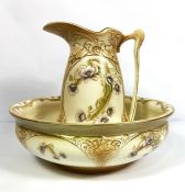A Staffordshire creamware washbowl and jug set, circa 1900, with flowers on a blush ivory ground (