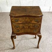 A small walnut veneered chest of drawers; together with a modern nest of tables and a hostess