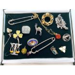 An assortment of jewellery and watches, including a pewter brooch in form of a rose deer; a