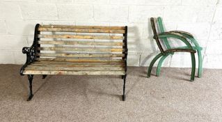 A vintage cast iron and wood slatted garden bench; also a pair of cast bench ends, and a set of four