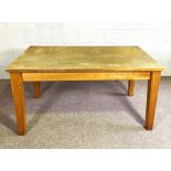 A vintage kitchen or work table, with plain top and tapered legs