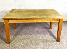 A vintage kitchen or work table, with plain top and tapered legs