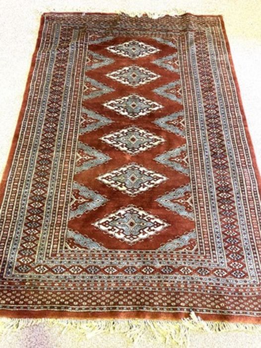 A modern Kazak rug, with six medallions on a dark burgundy ground, modern - Image 2 of 3