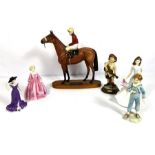 A small group of assorted ceramic figurines, including a Beswick model of Red Rum with jockey up and